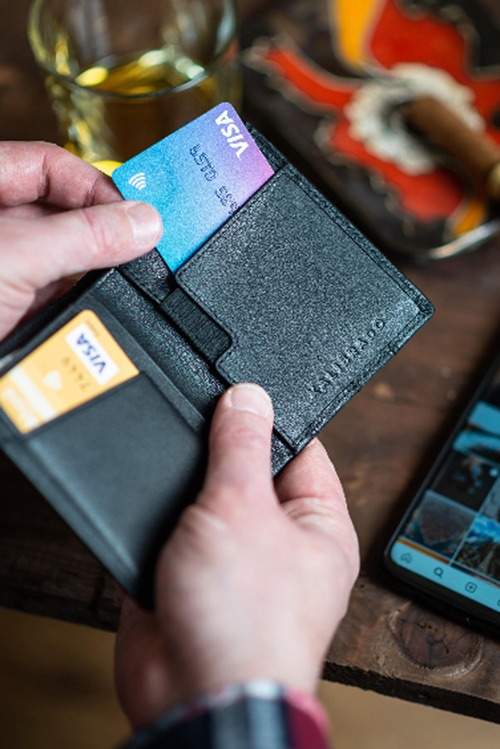 cropped view of african american waiter working with credit card