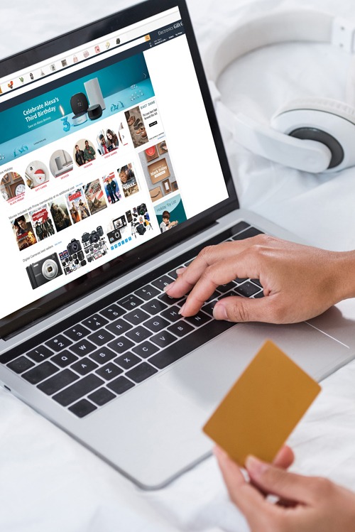 ropped view of african american waiter working with credit card